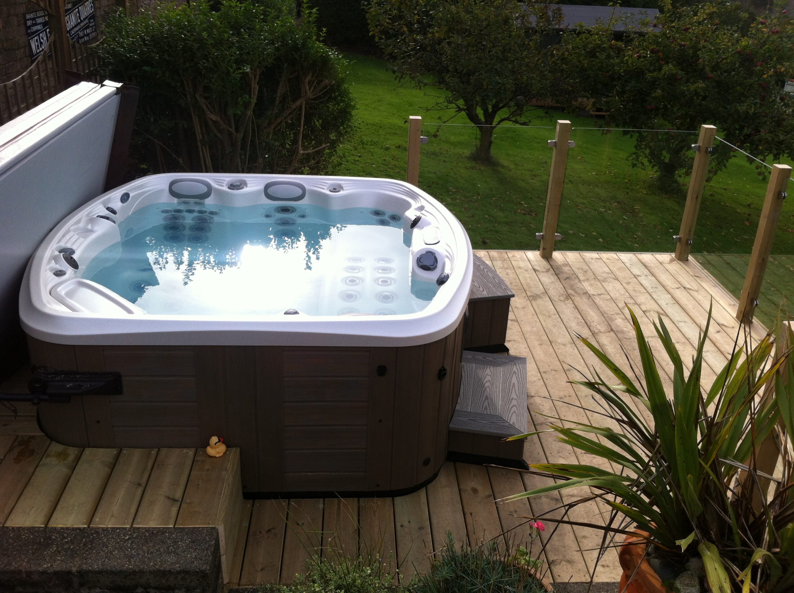 Marquis Spas Crown Resort Hot Tub with white shell on decking