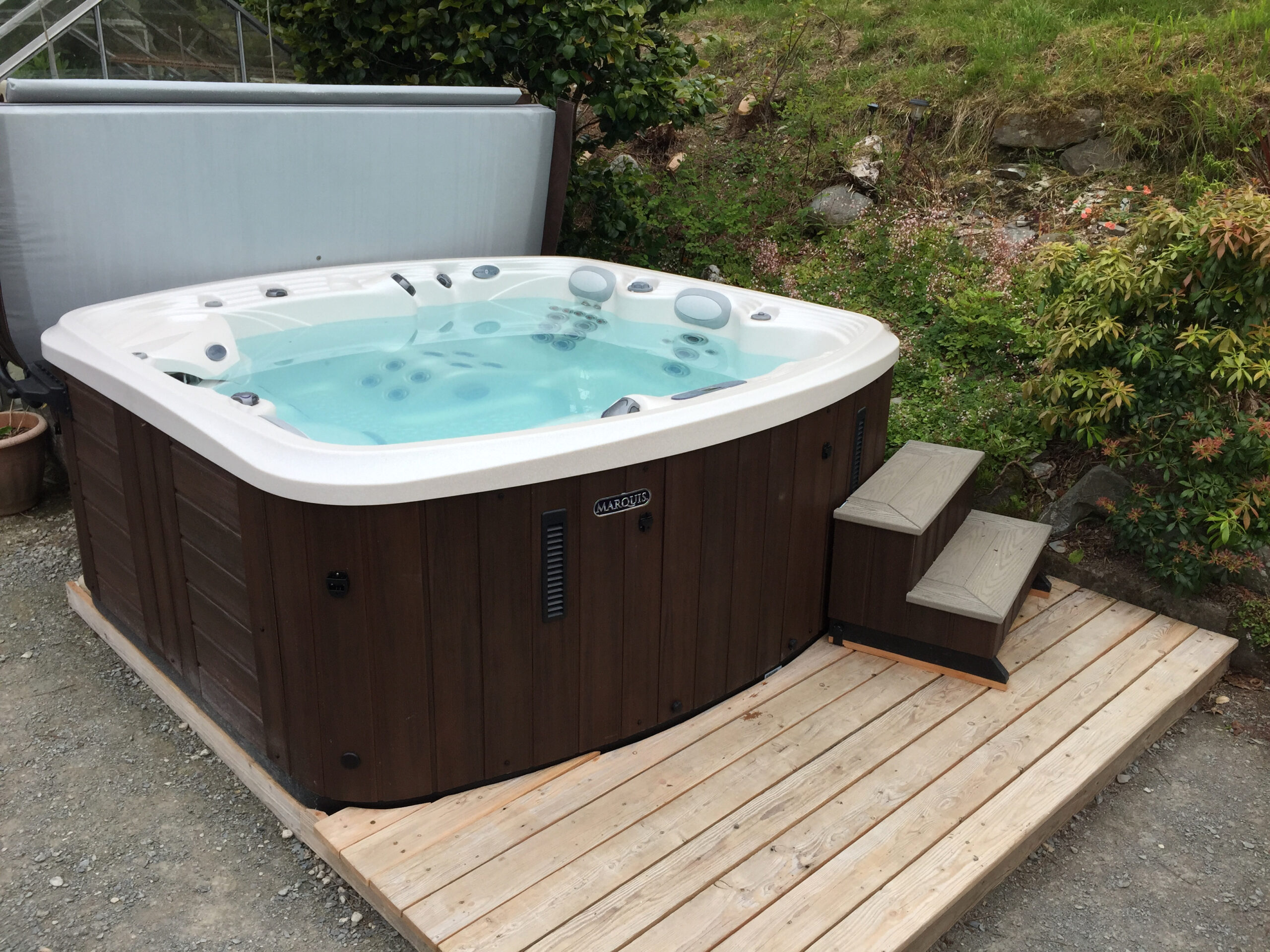 Marquis Spas Crown Resort Hot Tub with white shell on decking