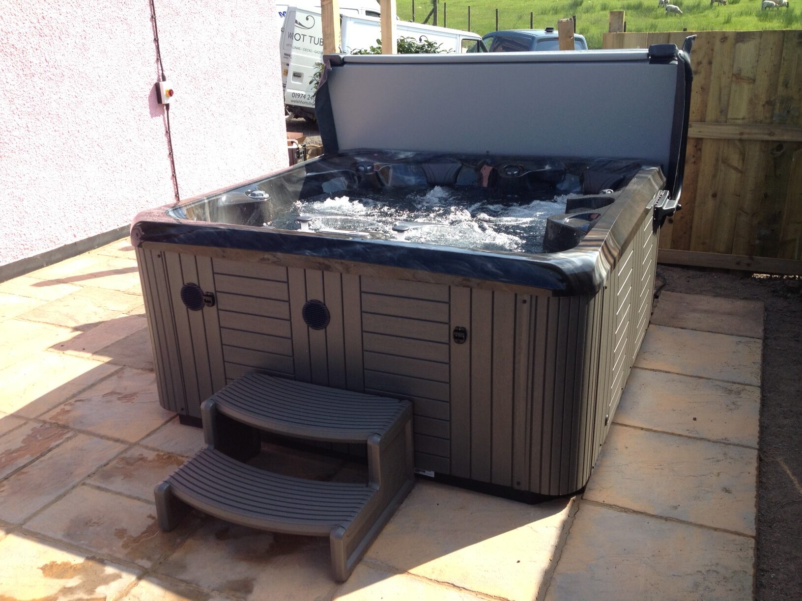 Marquis Spas Celebrity Broadway Hot Tub on a patio with jets on