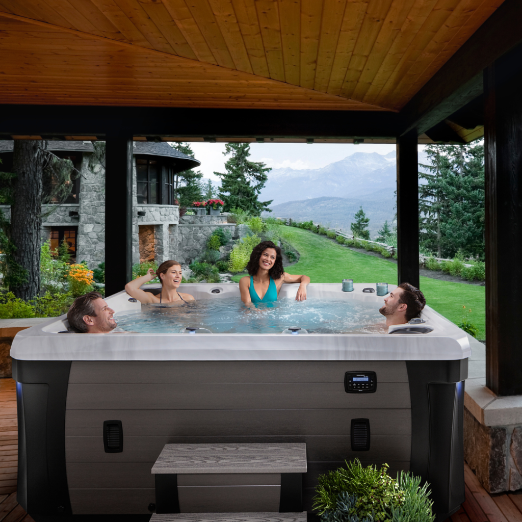 People enjoying a Marquis Spas Woodstock Elite hot tub on a veranda